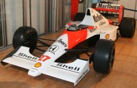 McLAREN - F1 MP4/5B HONDA V10 TEAM MARLBORO N 27 WORLD CHAMPION WINNER MONACO GP 1990 (with pilot figure + arm raised) AYRTON SENNA